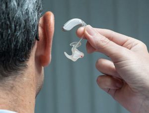 get fitted for the right hearing aid