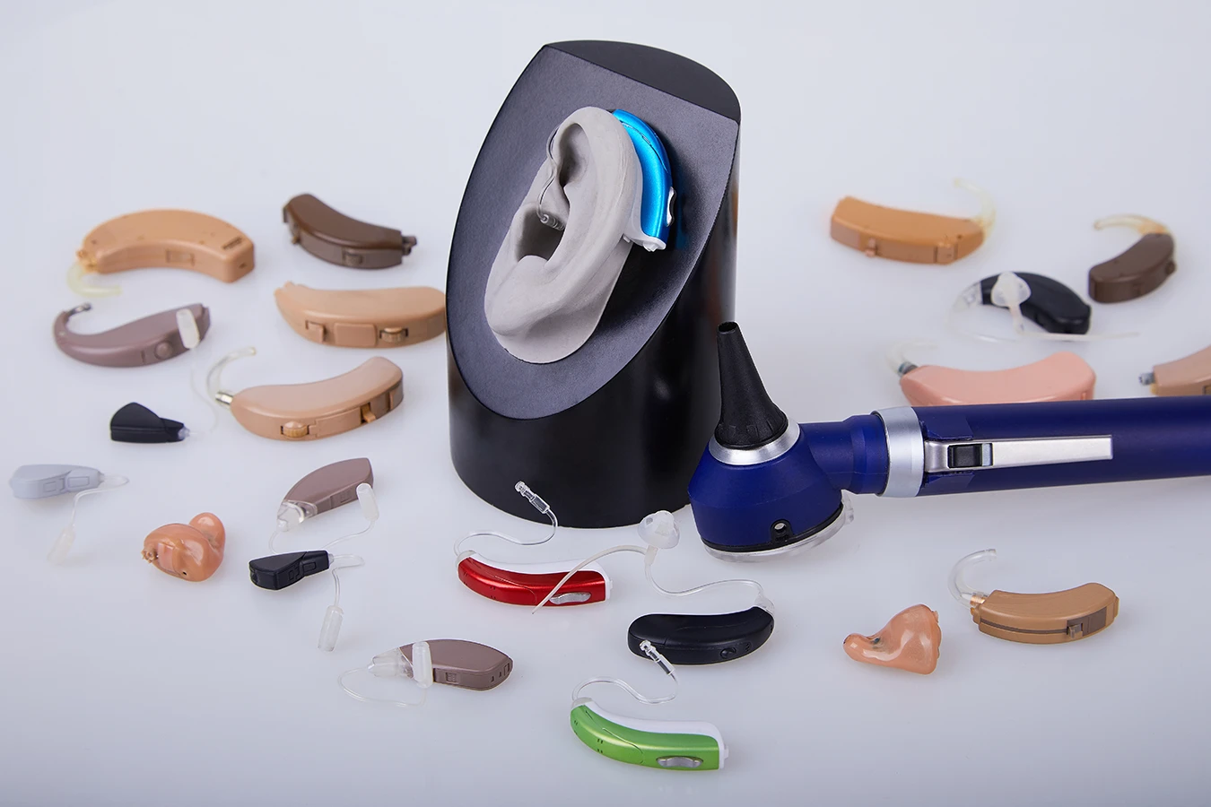 Various generic hearing aids in BTE and ITE styles on white background